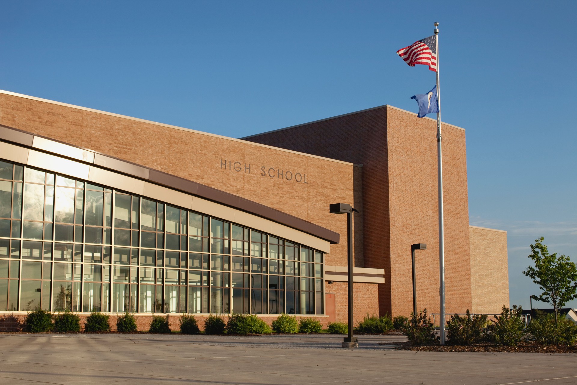 Modern high school with flagpole
